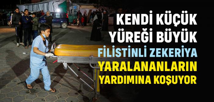 Filistinli Küçük Çocuk, Katil İsrail Saldırılarında Yaralananların Yardımına Koşuyor